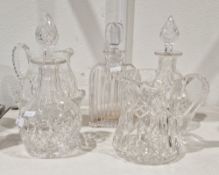 Two 20th century cut-glass decanters and stoppers, cut with diamonds, a compressed arched