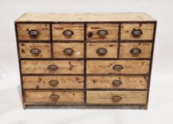 Early 20th century industrial pine chest comprising a bank of 13 drawers, each with iron cup