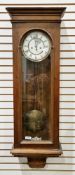 19th century walnut cased Vienna-style eight-day hanging wall clock, the glazed door opening to a