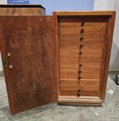 Collection of Meccano parts including gears, wheels, weights, hooks and brackets contained within