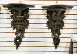 Pair of late 19th/early 20th century Blackforest carved wall brackets, each of trefoil form above