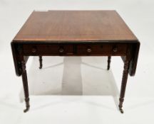 Mahogany and cross-banded drop-flap table in the Regency manner, with two ebony inlaid frieze