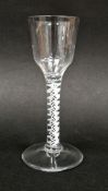 Mid-18th century cotton twist wine glass, the fluted bowl above a cotton helix twist stem on