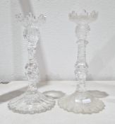 Pair of Georgian cut-glass candlesticks, each with serrated sconce and faceted baluster stem, on