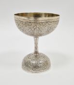 Indian white metal double ended spirit measure with chased Kutch decoration, 9cm high, 3.05ozt