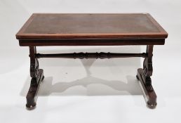 William IV rosewood library table, the rectangular top with inset writing surface and rounded