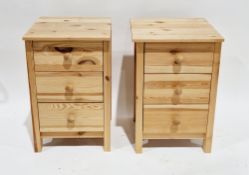 Pair of modern bedside cabinets, each with three drawers and pine knob handles, 61cm high x 38cm