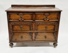 Early 20th century oak chest of drawers in the Jacobean manner, the rectangular top with upstand
