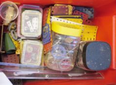 Quantity of vintage Meccano to include wheels, corner brackets, small Meccano tin holding a quantity