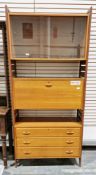 Mid-century Staples Ladderax teak modular wall unit comprising of three units including a drop-front