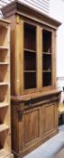 Victorian library bookcase, the moulded cornice over two doors with moulded edge opening to two