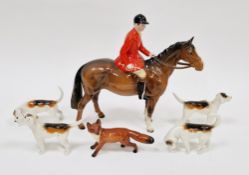 Beswick pottery equestrian figure of a huntsman, 22cm long and a fox and pack of four hounds,