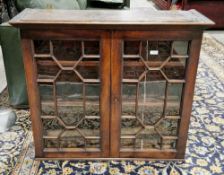 19th century mahogany bookcase, the twin astragal glazed doors opening to two fixed shelves, with
