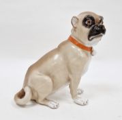 Continental porcelain model of a seated pug in the Meissen style, 20th century, blue crossed