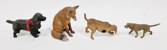 Four early 20th century cold painted metal animals including a seated fox (9cm high), black cocker