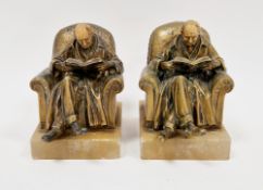 Two early 20th century gilt metal bookends on onyx bases, after J Ruhl, stamped J.B.H & Co for J B