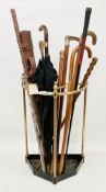 Early 20th century brass stickstand and assorted walking sticks and canes including a Victorian