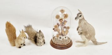 Three models of animals covered in real fur including kangaroo with joey, red squirrel and a grey