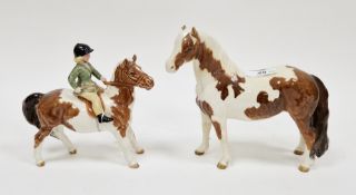 Beswick pottery model of a girl on a skewbald pony, printed factory marks, 13.2cm high and a Beswick