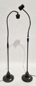 ' Ask Serious  Readers' black floor lamp or light with swan neck column together with another