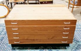 Mid century pine plan chest having five long drawers with chrome handles, on a plinth base (possibly