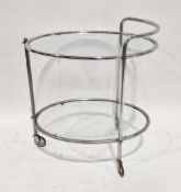 Art Deco tubular chrome plated cocktail trolley, the two tiers with glass shelves, on three castors,