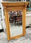 Modern pine mirror in the Regency manner with bevelled edge, 102cm x 67cm