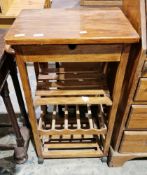 Modern stained wooden kitchen trolley with single drawer, towel rail, two slatted shelves and a wine