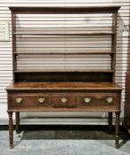 George III oak dresser, the upper section with a moulded cornice and three open back plate