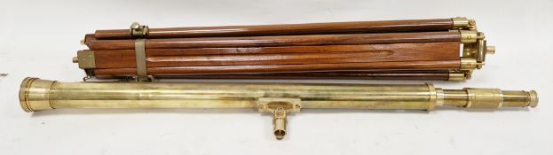 Reproduction brass telescope on a mahogany and brass tripod folding stand, telescope 96.5cm long