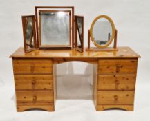 Modern pine dressing table having two pedestals of three drawers with turned pine handles, 70cm high