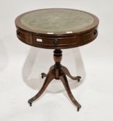 Reproduction mahogany veneer circular drum-top occasional table with gilt tooled leather panel to