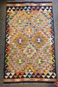 Chobi Kilim blue ground rug with geometric pattern design flanked by single geometric border 131cm x