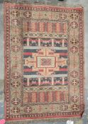 Turkish red ground rug with central hooked geometric medallion on striped field, single elephant