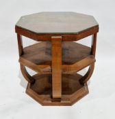 Art Deco walnut square veneer octagonal centre table, the top with glass cover over a shelf and