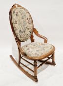 Victorian beech and hardwood rocking chair with oval back, shaped cresting, floral tapestry padded
