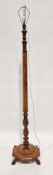 Early 20th century walnut banded lamp with part hexagonal column and part baluster column, on an