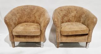 Pair of Oka Crosby light brown leather upholstered tub armchairs, the backs with a studded and