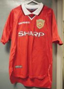 Vintage Manchester United youth shirts and jerseys including Umbro Sharp home kit, Umbro Vodafone