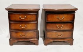 Pair of modern hardwood effect bow fronted bedside chests of drawers, each with three drawers and