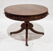 Mahogany drum table in the Regency manner, the circular top with four frieze cockbeaded drawers
