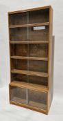 Mid-century Simplex teak sectional stacking bookcase, the six sections each having glass sliding