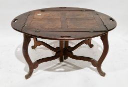Late 19th / early 20th century oak butler's stand, the oval top with four folding flaps having