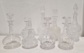 Group of eight cut-glass and etched decanters and stoppers, including: a Victorian globular decanter