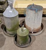 Three vintage galvanised poultry feeders, each of cylindrical form, two by Eltex, one lacking cover,