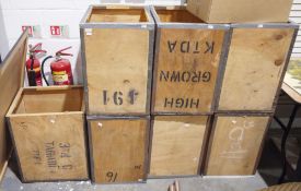A group of seven vintage wooden tea chests