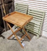 Contemporary painted green slatted wood folding picnic table and chair and a two-handled butler's