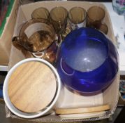 Pair of small oils on canvas featuring African rural scenes, a small collection of books to