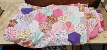 Vintage pink cotton double-sized patchwork quilt bedspread, with hexagonal fabric panels, mostly