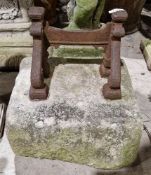 19th century cast iron boot scraper set in a rectangular stone base, 36cm high x 33cm wide Condition